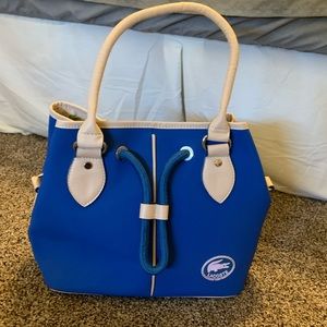 Gently used Lacoste purse with detachable strap